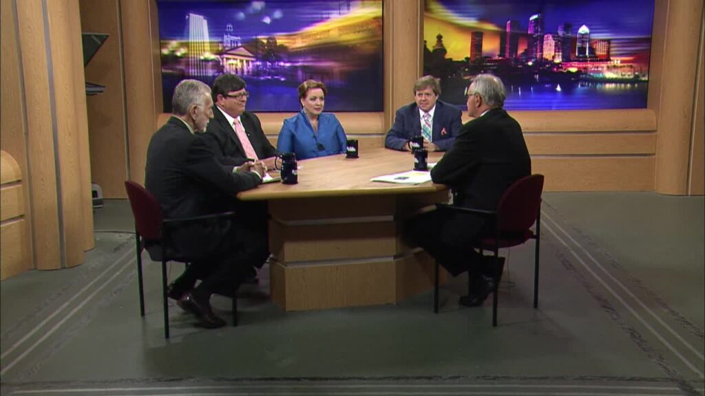 Photo of Susan Nilon sitting at a round table with other reporters and pundits withRob Lorei on WEDU's Florida This Week